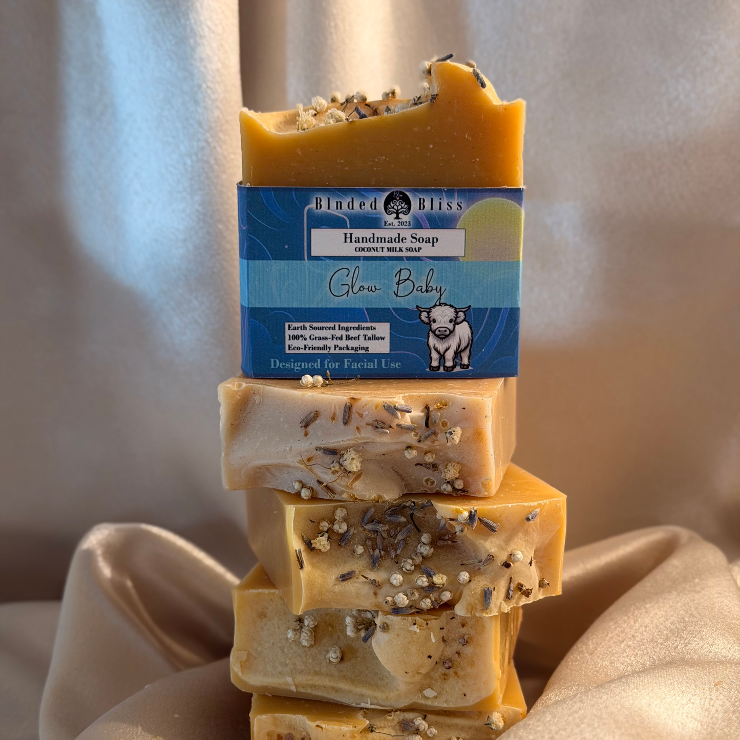 A stack of Glow Baby natural bar soap by Blnded Bliss.