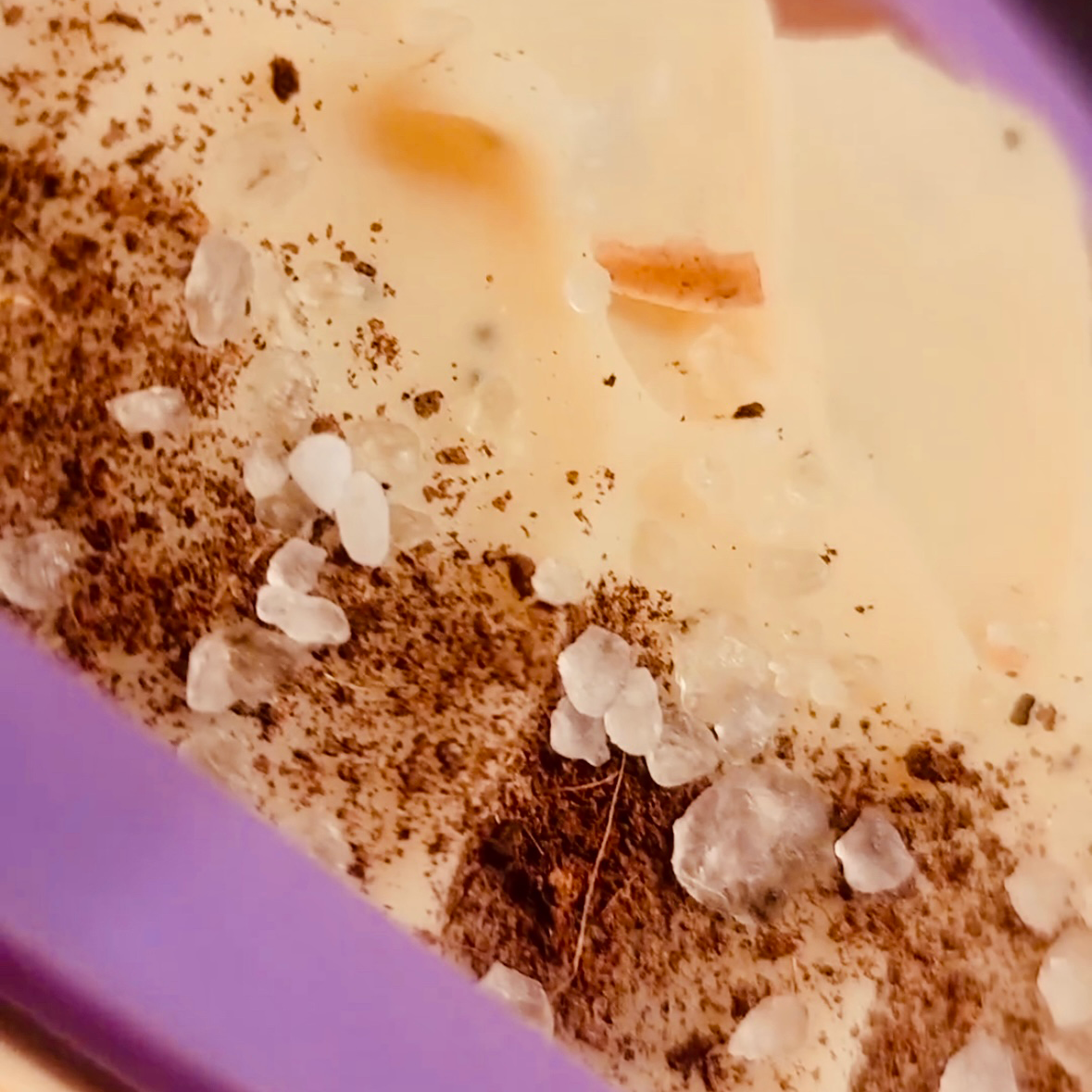 A close up image of blnded bliss coconut orange essential oil soap, prior to being cut.