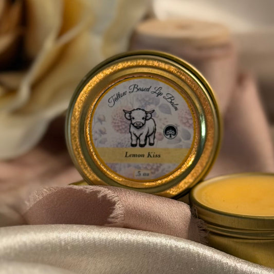 A tin container of Blnded Bliss 'Lemon Kiss' tallow based lip balm.