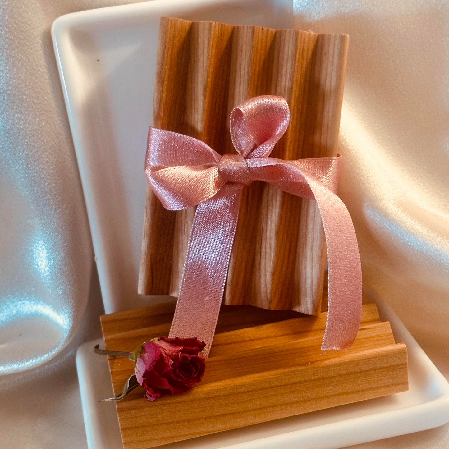 Soap saver wrapped with a ribbon.