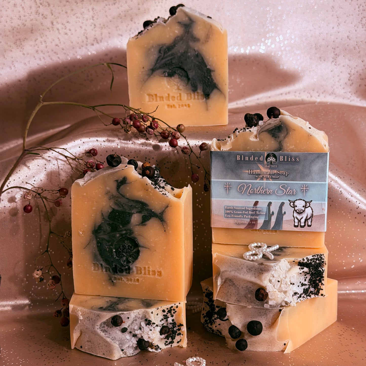 Wrappedn and unwrapped blnded bliss handmade tallow patchouli and vanilla soap bars.