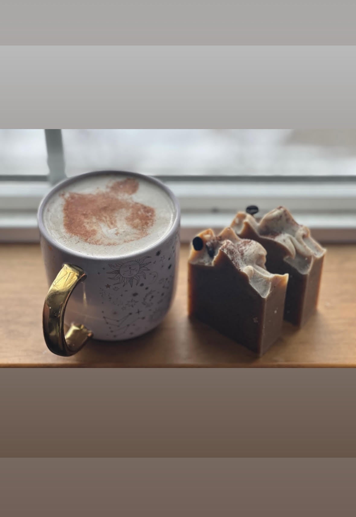 Coffee cup to the right of the just cut soap bars