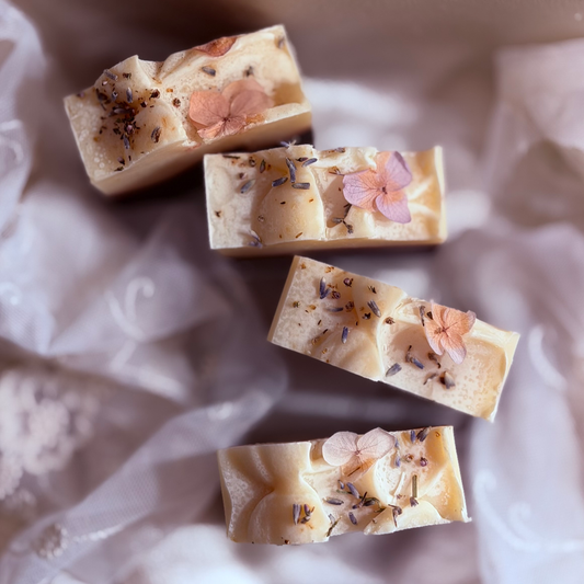 Four bars of blnded bliss lavender frankincense soap. 