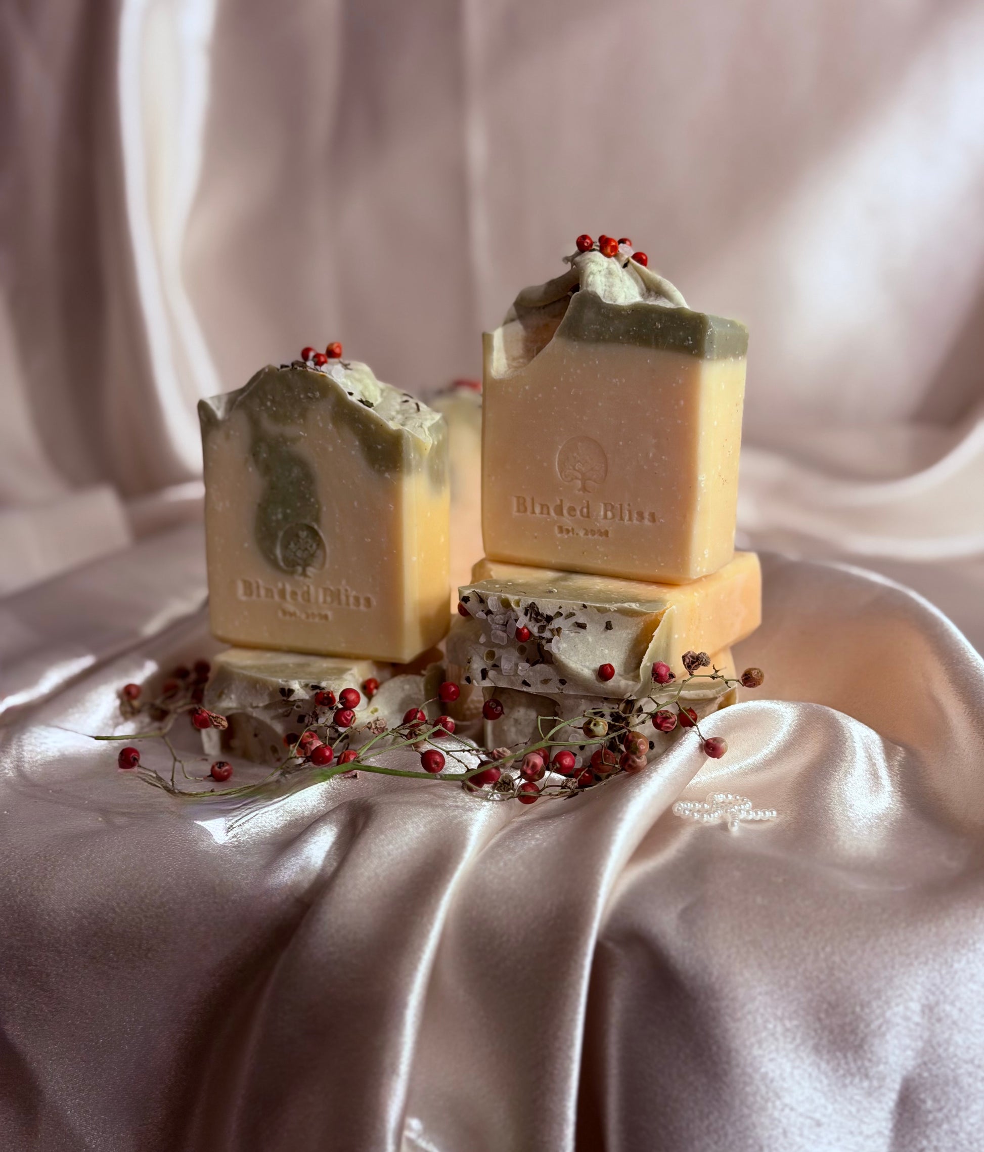 Blnded BLiss Rosy's Snowbar bar soap stacked on a satin cloth